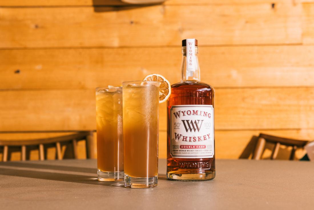 Double Cask Bourbon and two glasses of a peach toddy