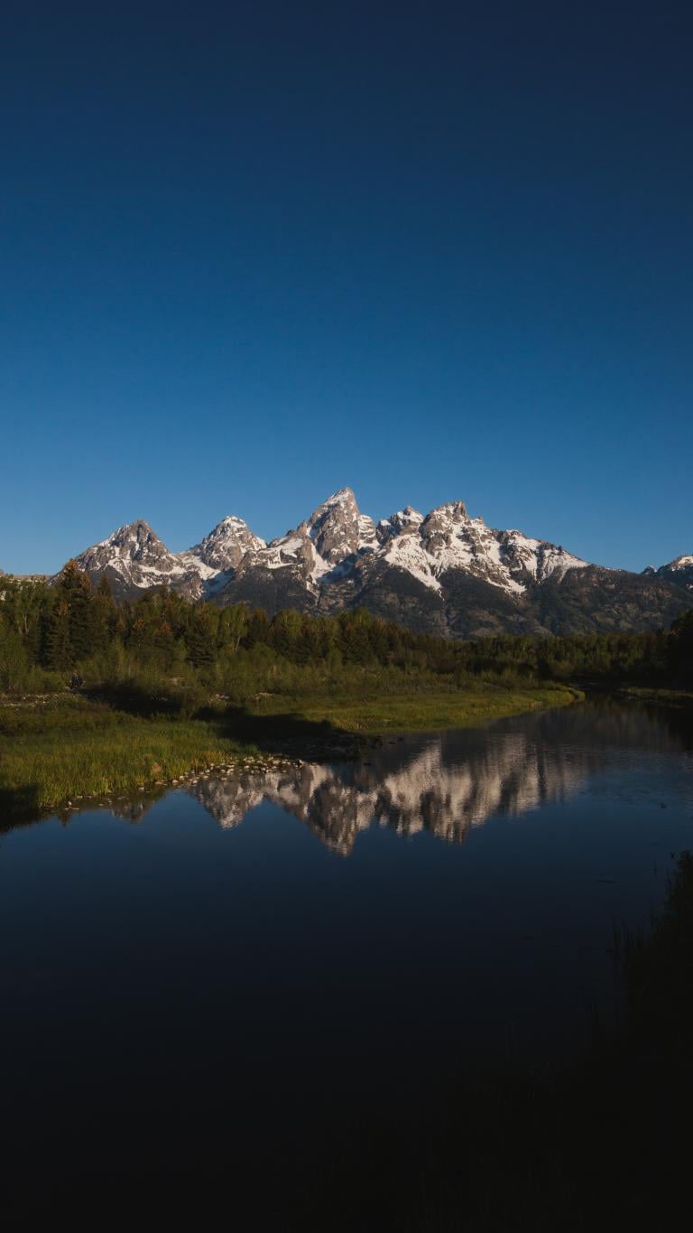 Mountains reflecting on a river
