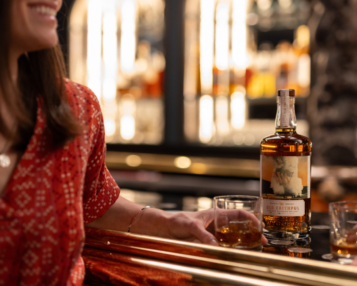 Women with whiskey at a bar