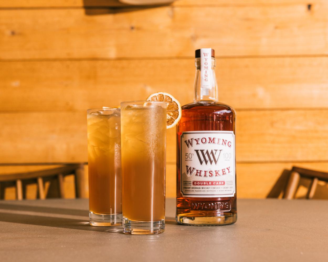 Double Cask Bourbon and two glasses of a peach toddy