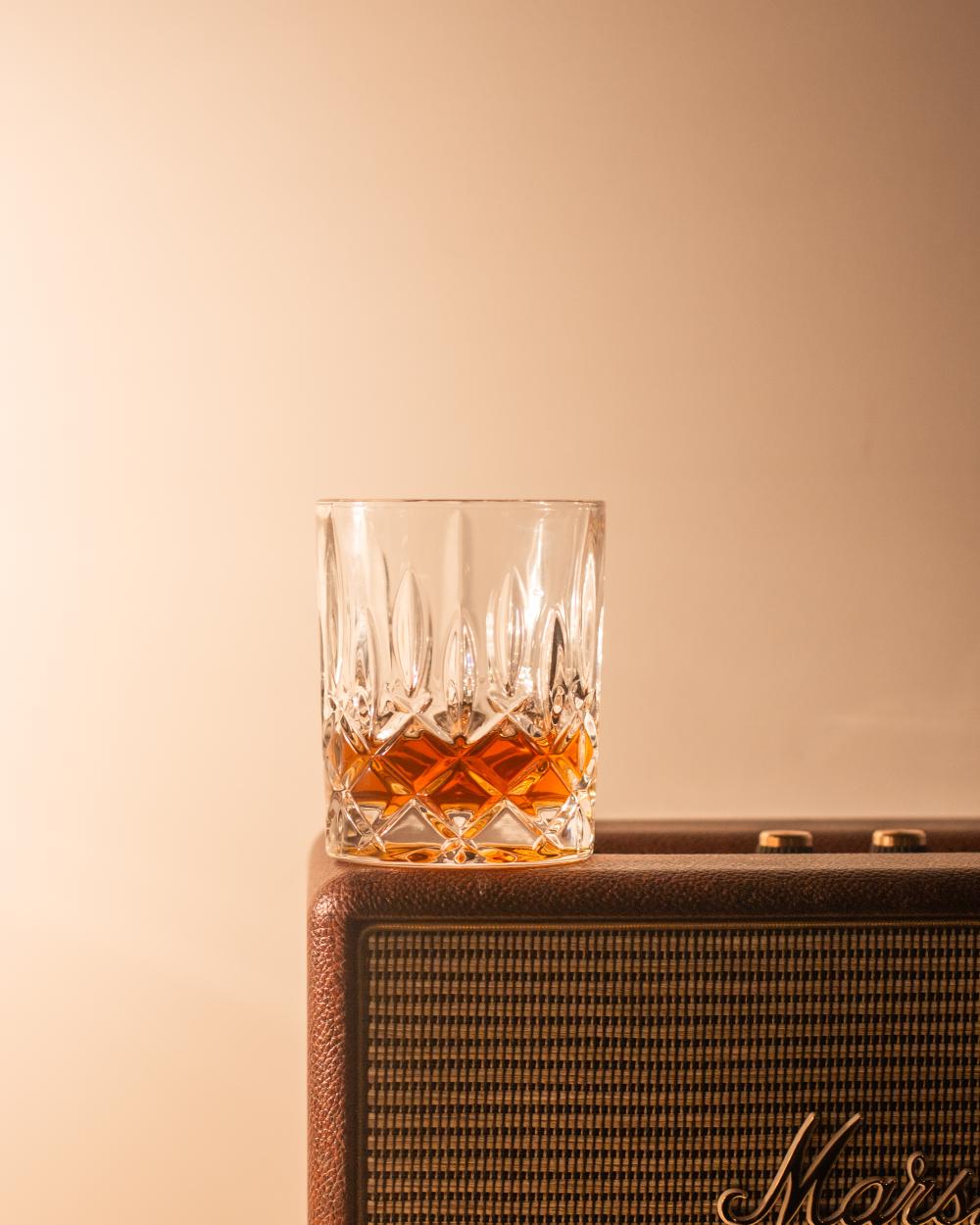 Glass of Whiskey on a speaker