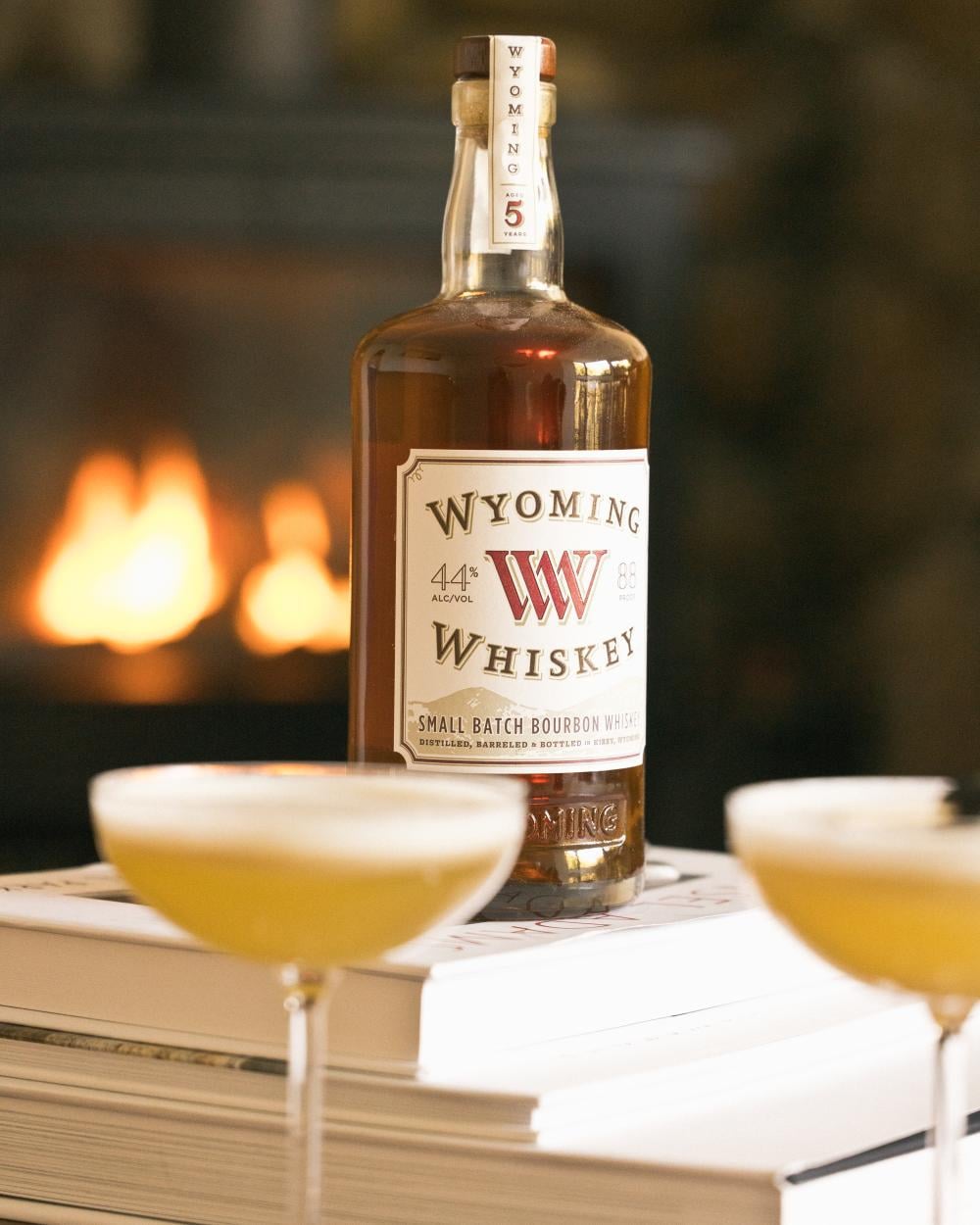 Whiskey on top of books with cocktails 