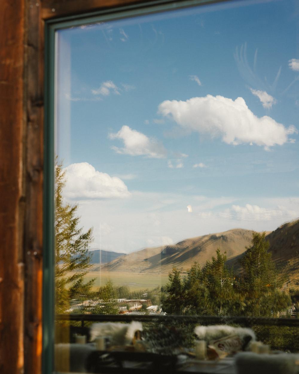 looking out a window onto Yellowstone National Park