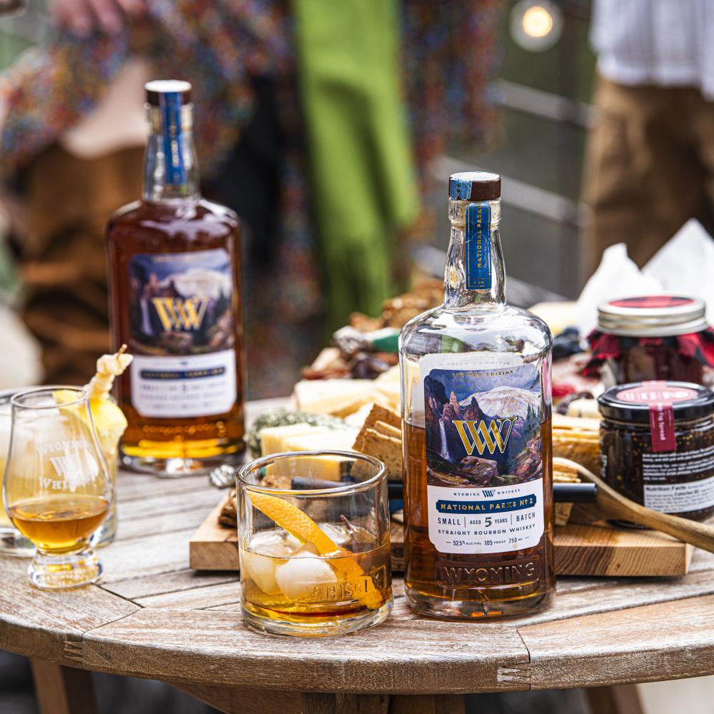 Bottles, and whiskey glasses on a table