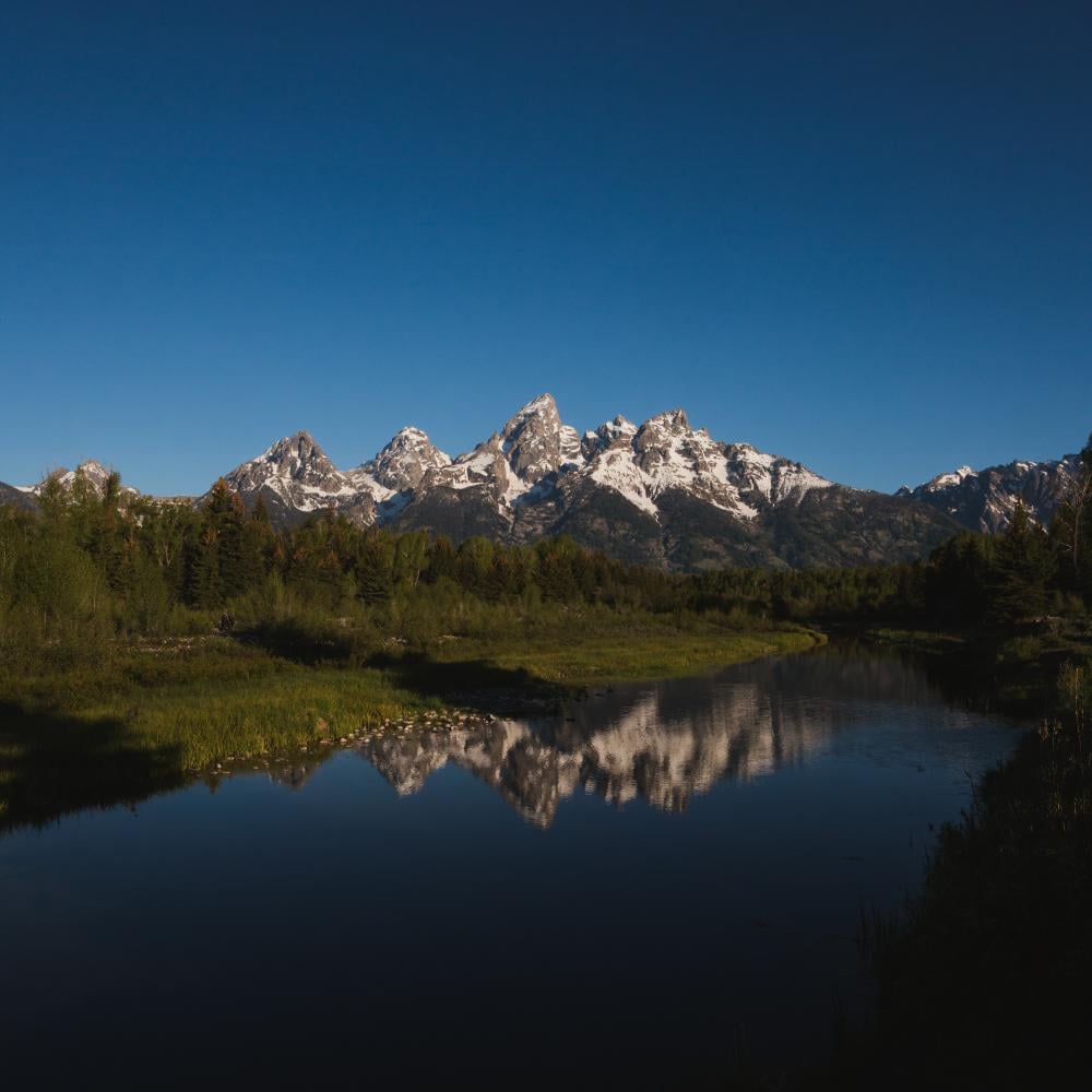 Mountains reflecting on a river