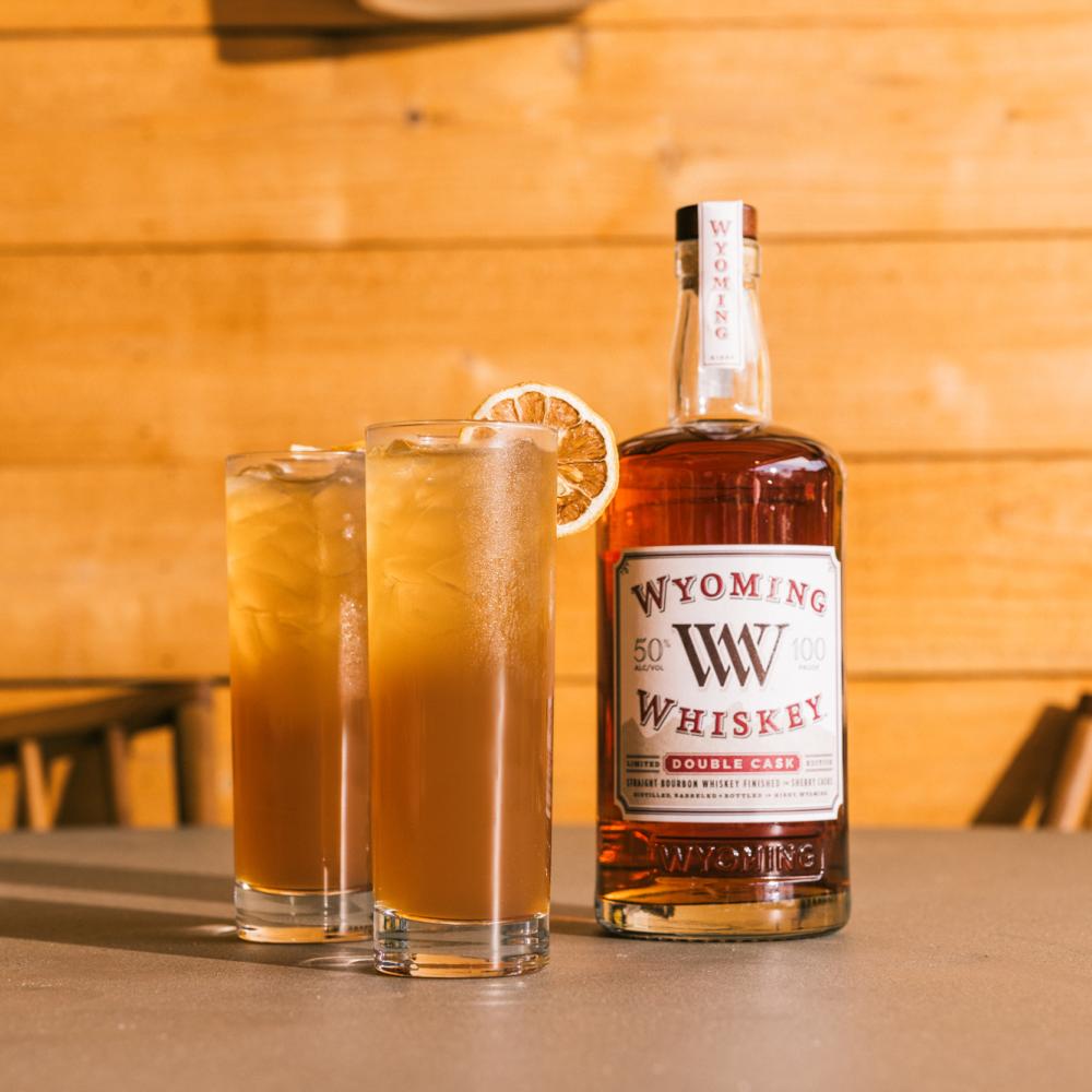 Double Cask Bourbon and two glasses of a peach toddy