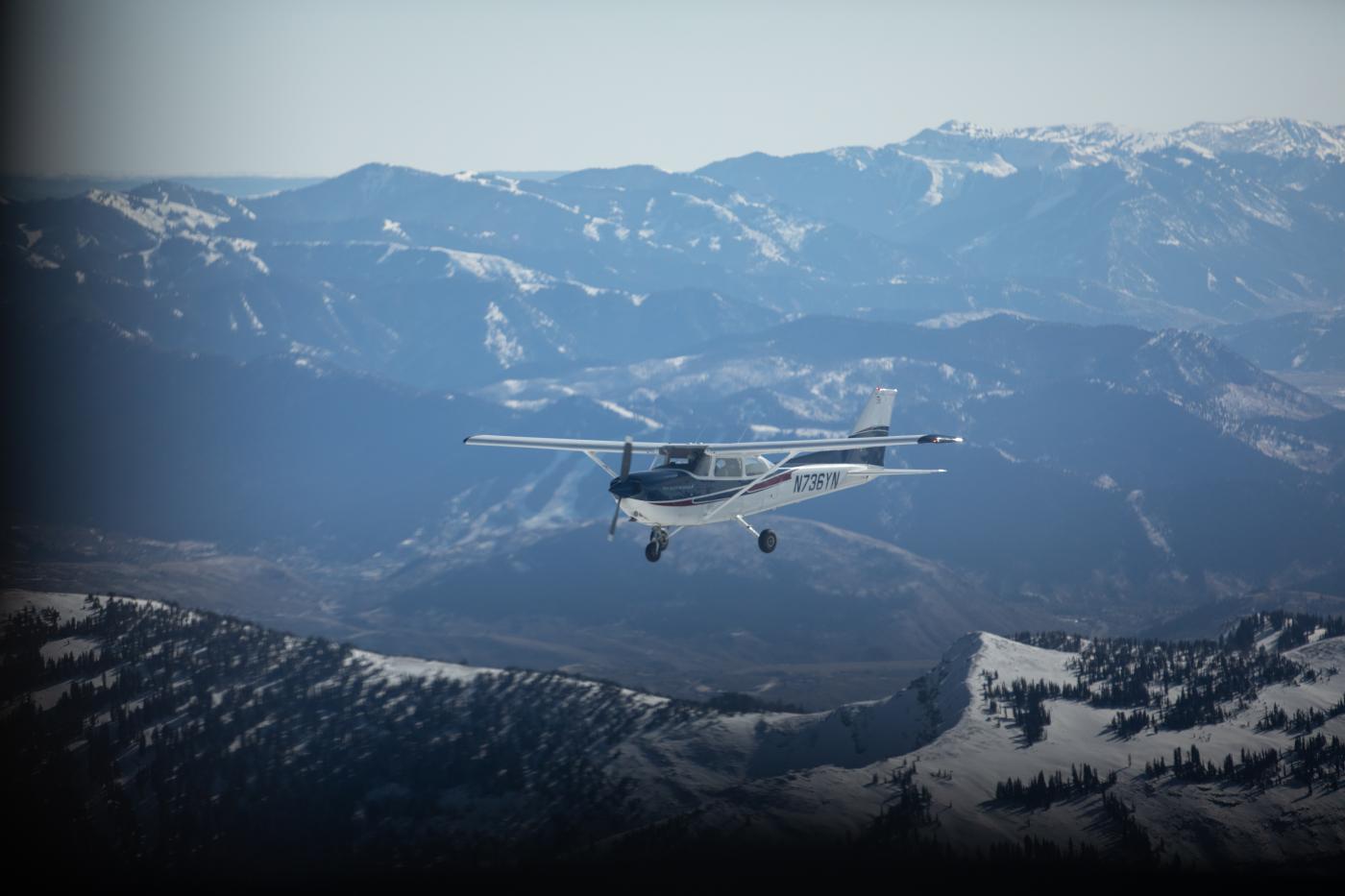 Airplane flying above mountains